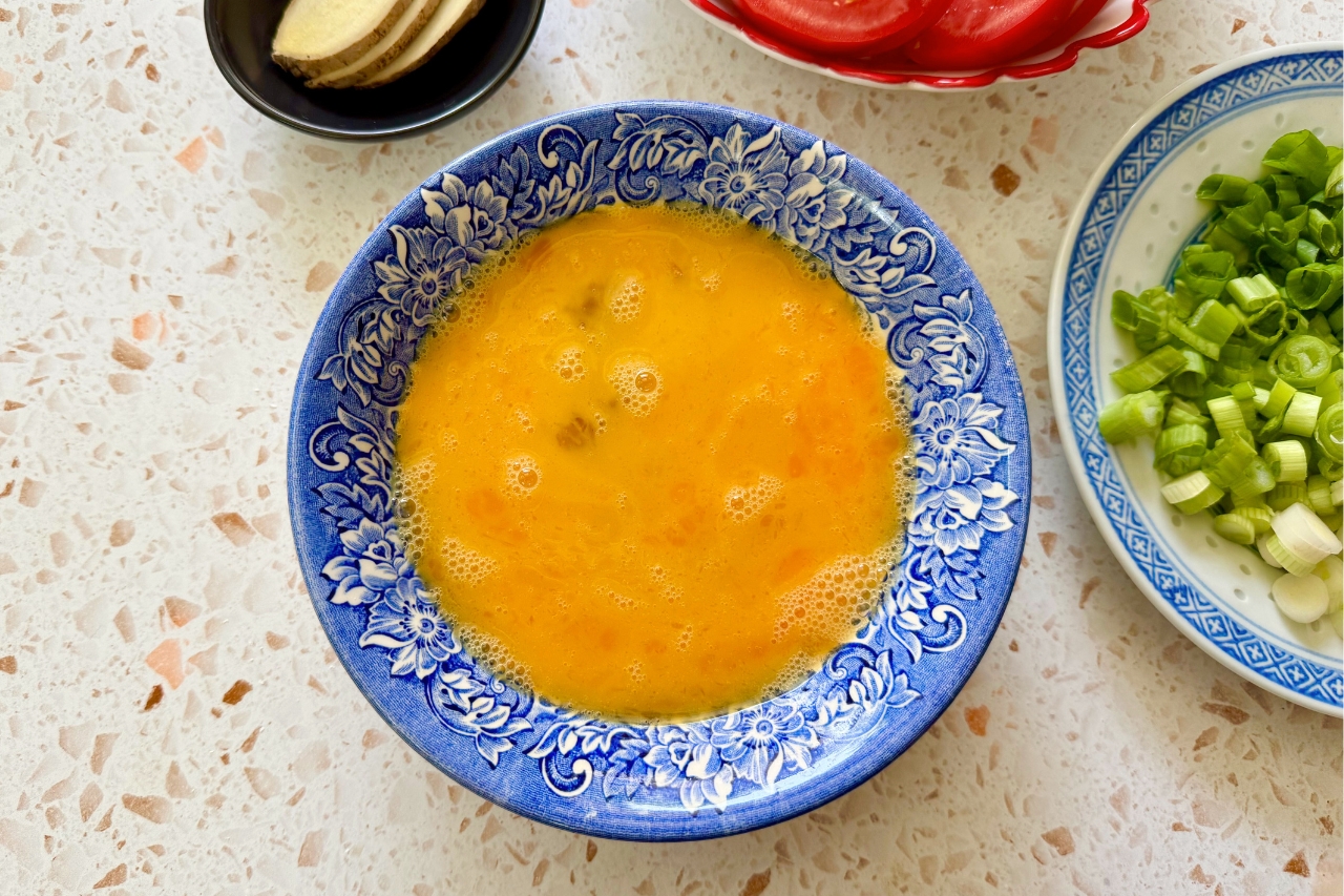 Raw scrambled eggs in a bowl